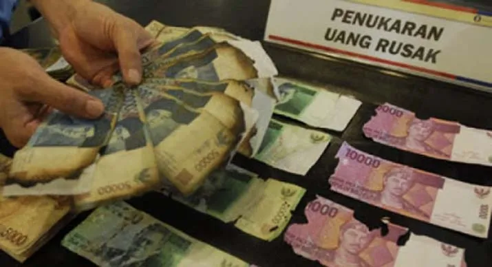Ilustrasi uang rusak